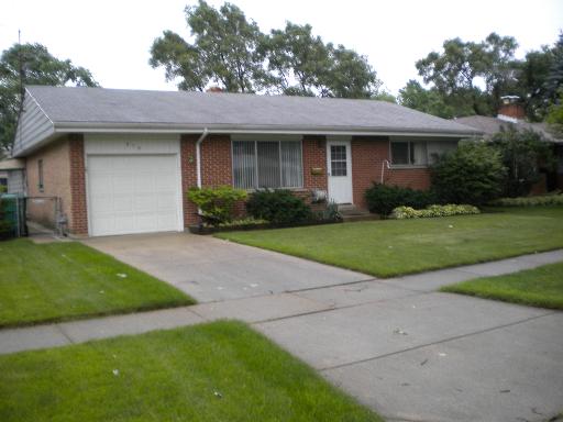 379 Stone Place Wheeling, IL 60090 - Photo 1 of 1 a front view of a house with a yard and garage