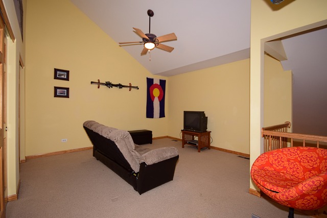 1859 Wagner Road Batavia, IL 60510 - Photo 20 of 25 a living room with furniture and a flat screen tv