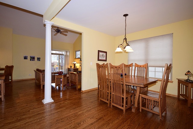1859 Wagner Road Batavia, IL 60510 - Photo 3 of 25 a view of a dining room with furniture window and wooden floor