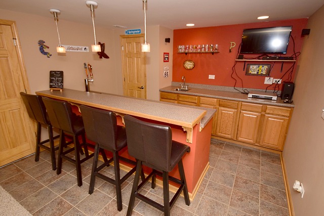 1859 Wagner Road Batavia, IL 60510 - Photo 23 of 25 a kitchen with stainless steel appliances granite countertop a table chairs sink and microwave