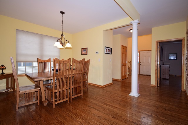 1859 Wagner Road Batavia, IL 60510 - Photo 4 of 25 a view of a dining room with furniture window and wooden floor