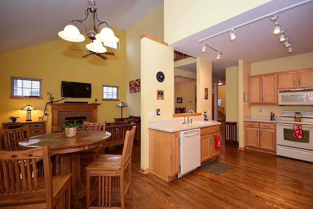 1859 Wagner Road Batavia, IL 60510 - Photo 5 of 25 a large kitchen with stainless steel appliances granite countertop a stove and a wooden floors