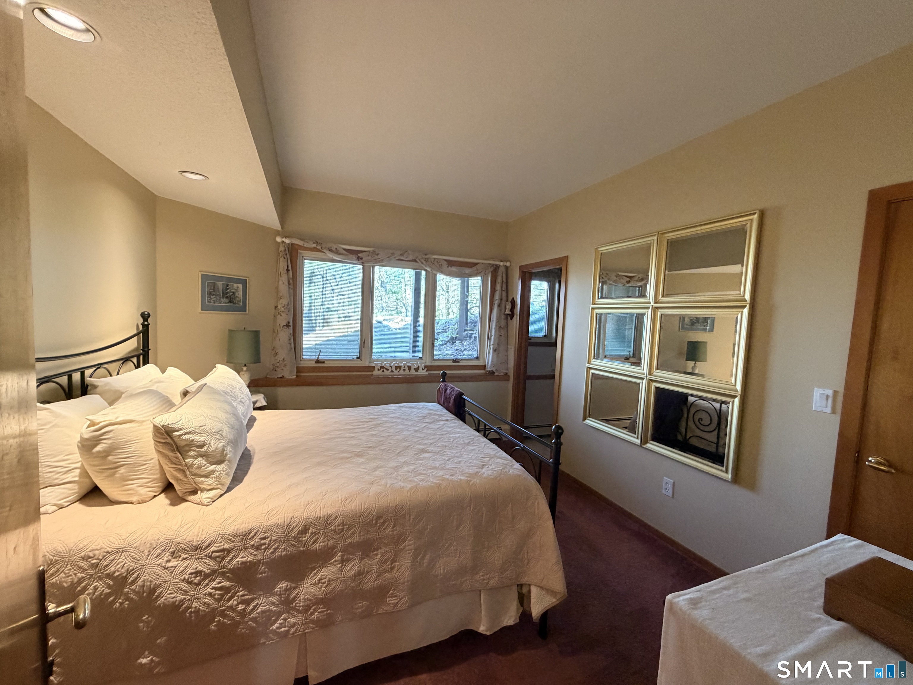 86 Washburn Road Canton, CT 06019 - Photo 13 of 40 a bedroom with a large bed and a window