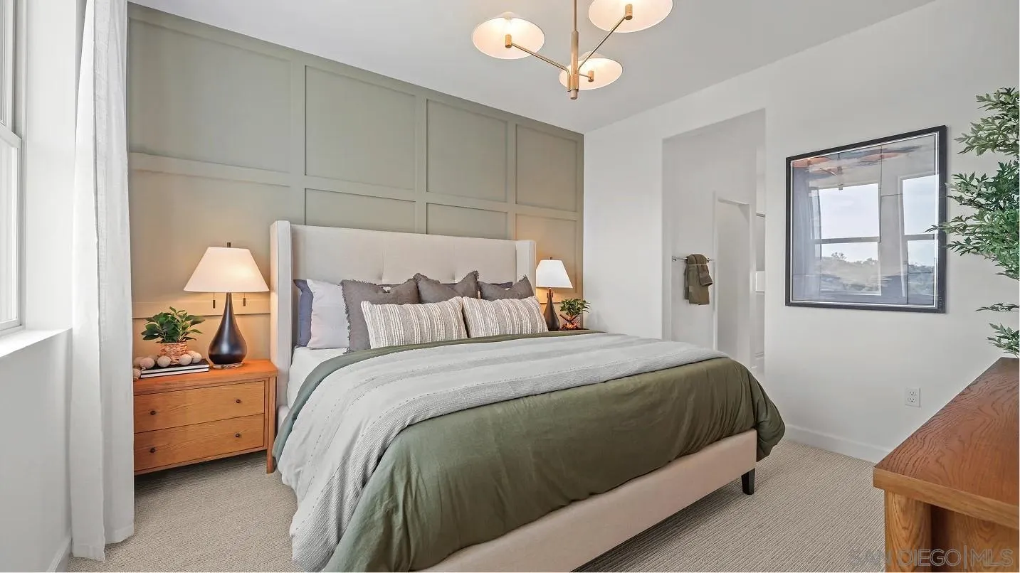 322 Honeysuckle Way Oceanside, CA 92057 - Photo 6 of 12 a bedroom with a bed and a chandelier
