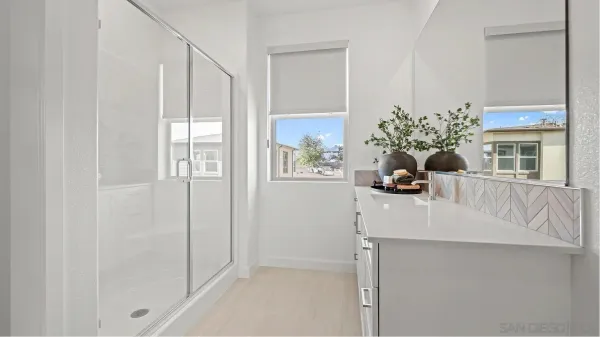 a view of kitchen with cabinets and window