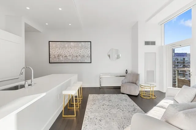 a living room with furniture and a table