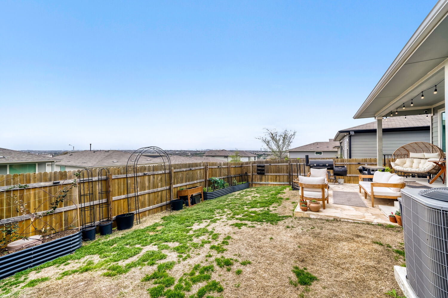 2308 Ranier Court Austin, TX 78754 - Photo 25 of 29 Fenced backyard featuring a patio area and outdoor lounge area