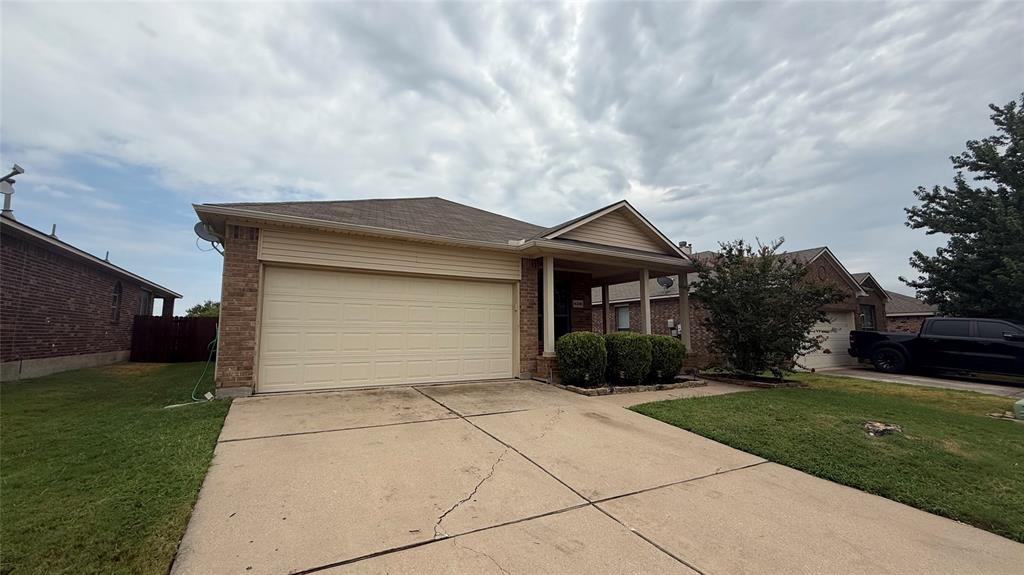 14308 Polo Ranch Street Fort Worth, TX 76052 - Photo 2 of 19 Single-story residence featuring a brick and siding facade with an attached two-car garage