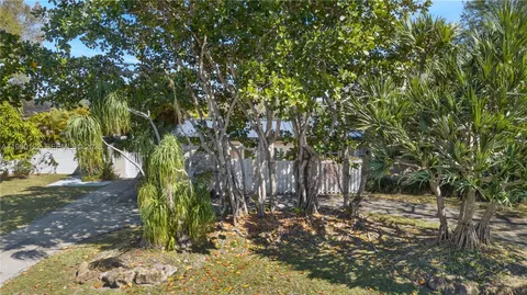 a backyard of a house with large trees