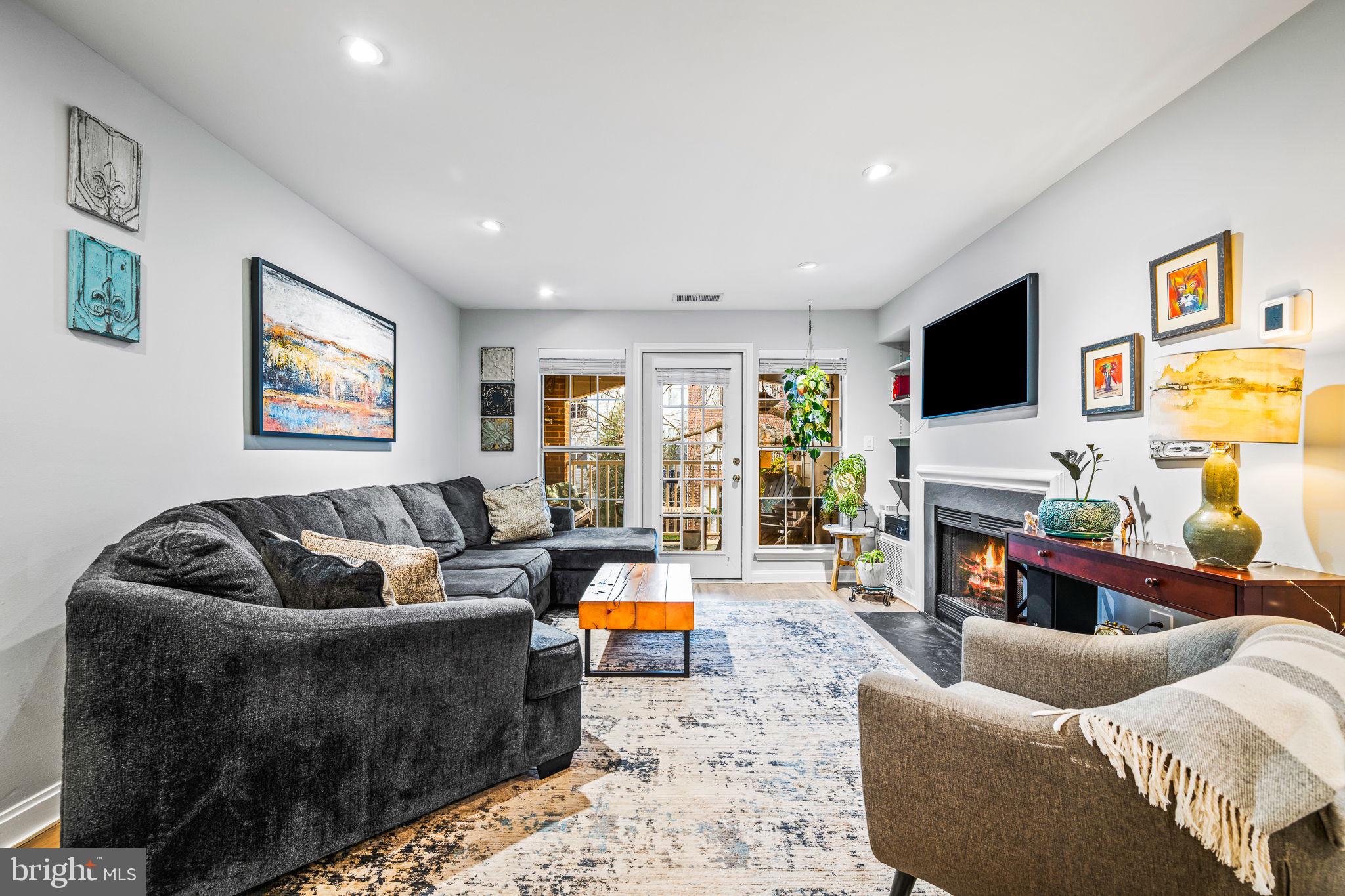 20951 Timber Ridge Terrace, Unit 204 Ashburn, VA 20147 - Photo 5 of 26 Spacious Living Room with Entrance to Balcony