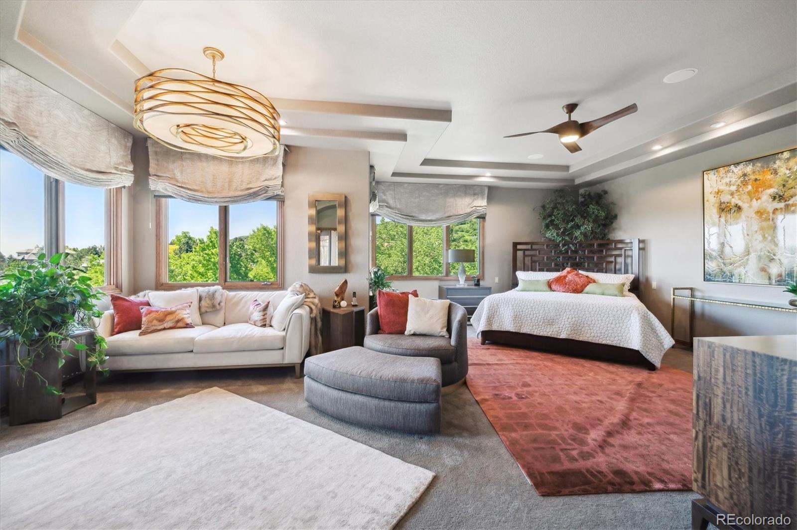 16134 Sandstone Drive Morrison, CO 80465 - Photo 12 of 30 a bedroom with a bed and a couch