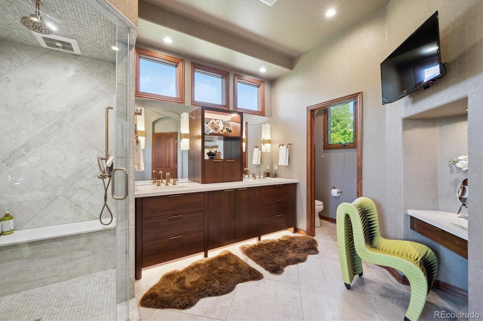 16134 Sandstone Drive Morrison, CO 80465 - Photo 15 of 30 a living room with furniture and a flat screen tv