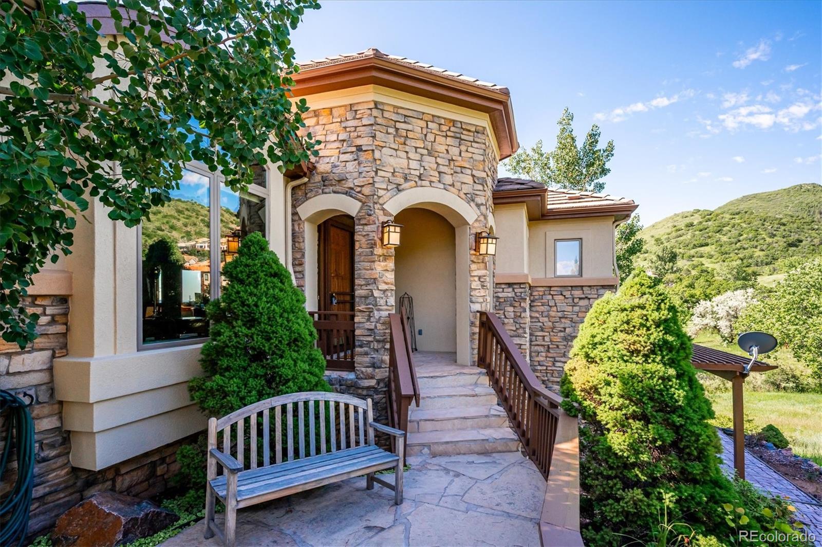 16134 Sandstone Drive Morrison, CO 80465 - Photo 29 of 30 a view of a house with a yard