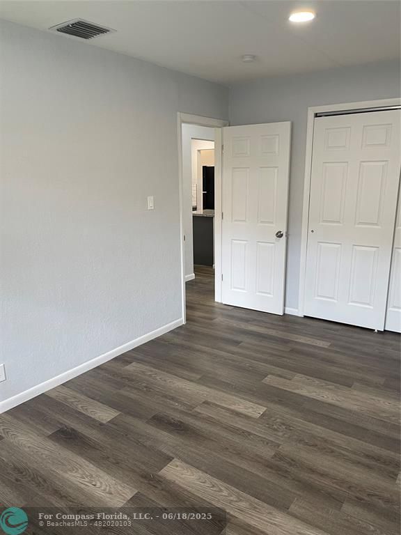 5631 Northwest 15th Street Lauderhill, FL 33313 - Photo 11 of 20 a view of an empty room and wooden floor