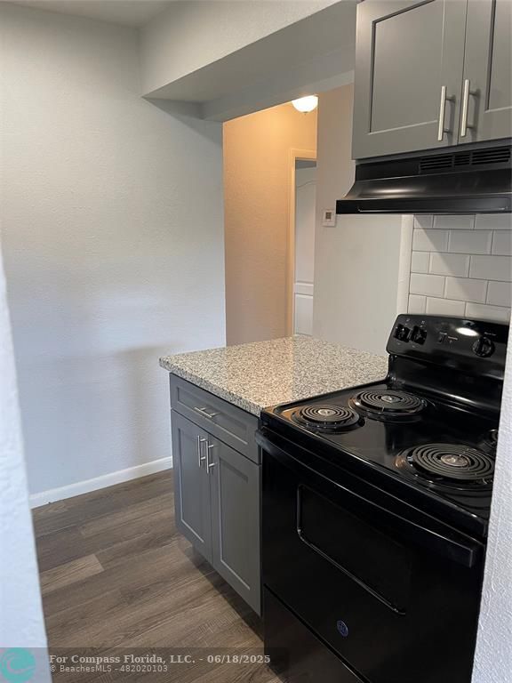 5631 Northwest 15th Street Lauderhill, FL 33313 - Photo 20 of 20 a stove top oven sitting inside of a kitchen