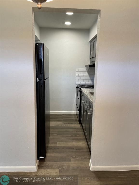 5631 Northwest 15th Street Lauderhill, FL 33313 - Photo 3 of 20 a kitchen with a refrigerator and a stove