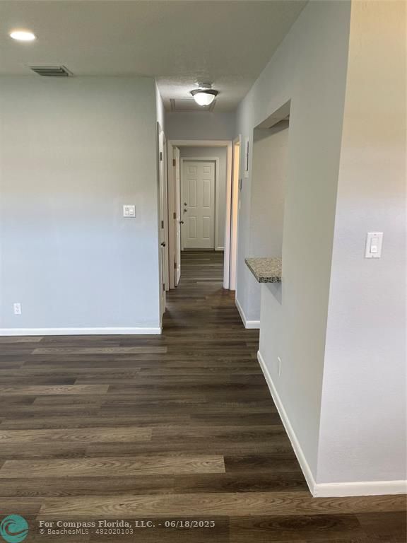 5631 Northwest 15th Street Lauderhill, FL 33313 - Photo 5 of 20 a view of a hallway with wooden floor and staircase