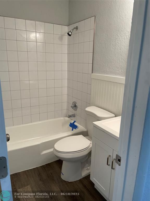 5631 Northwest 15th Street Lauderhill, FL 33313 - Photo 10 of 20 a white toilet sitting next to a bath tub
