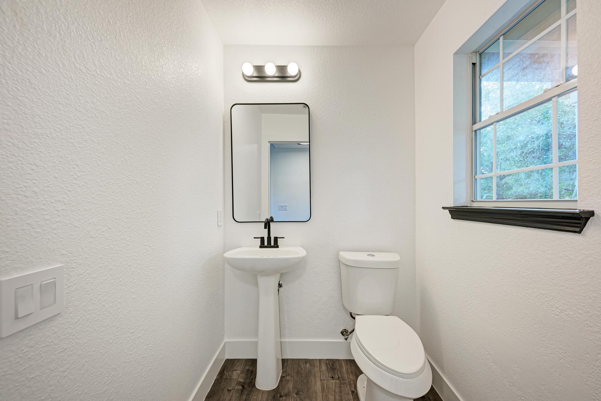 18108 Belfry Pass Manor, TX 78653 - Photo 22 of 40 Half Bathroom Downstairs