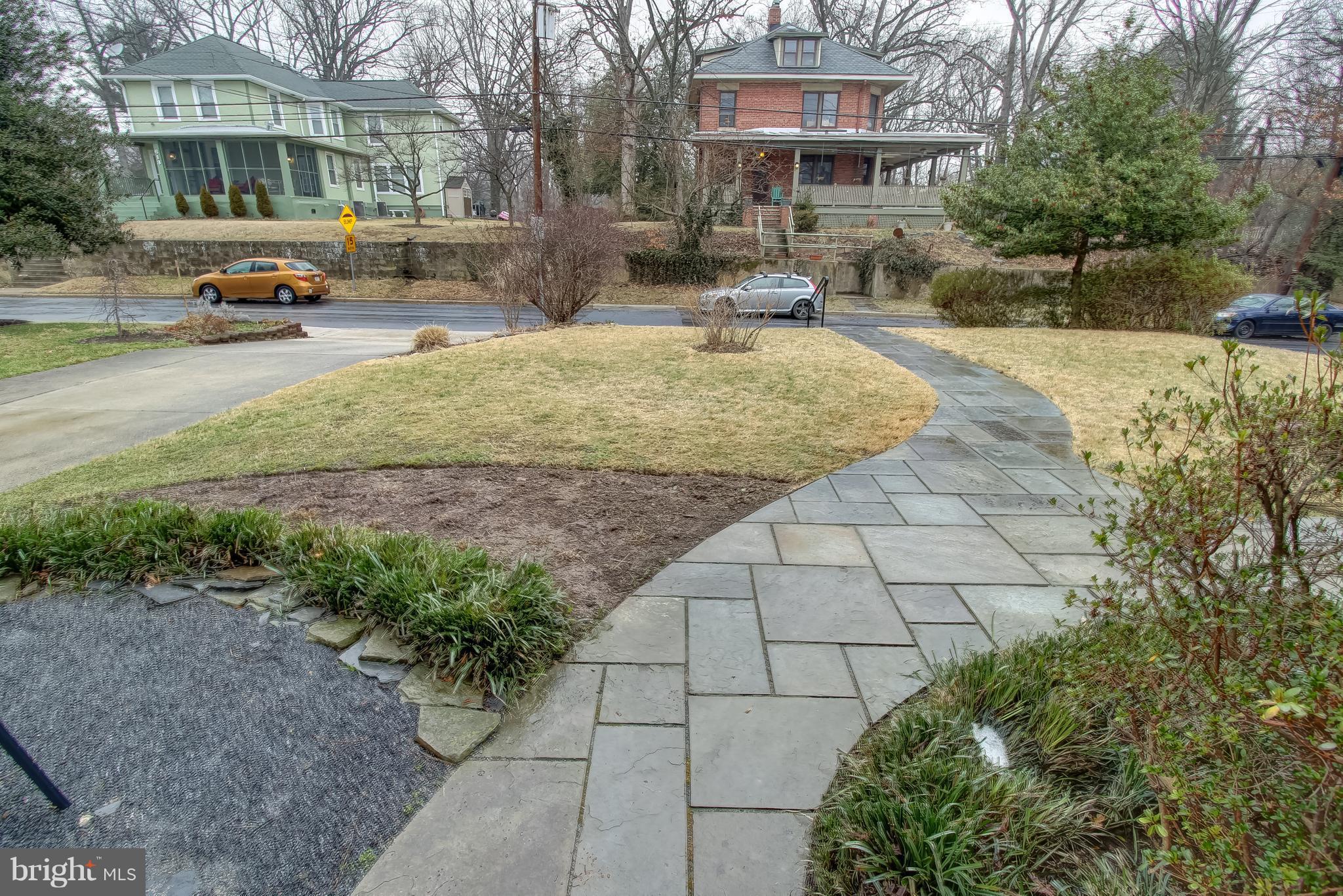 606 Ritchie Avenue Silver Spring, MD 20910 - Photo 3 of 27 a street view with a building and trees in the background