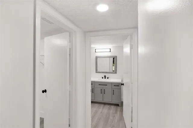 a en suite bathroom with a sink a mirror and a shower