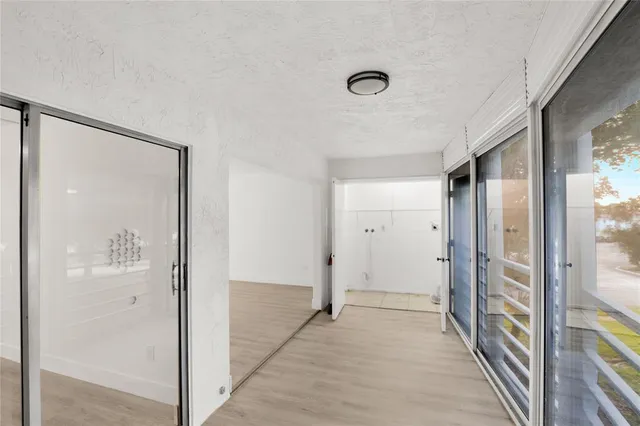 a view of a bathroom from a hallway