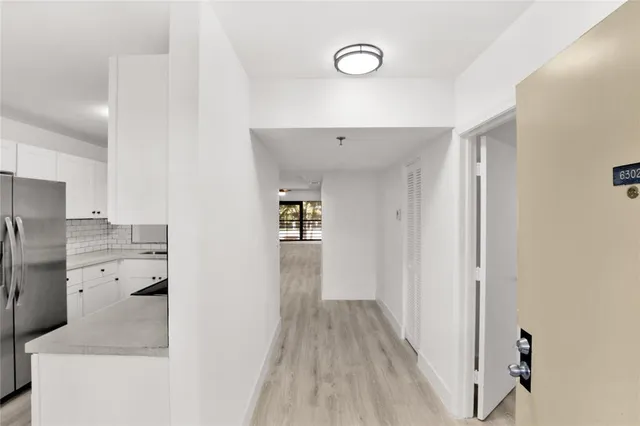 a view of a kitchen from the hallway