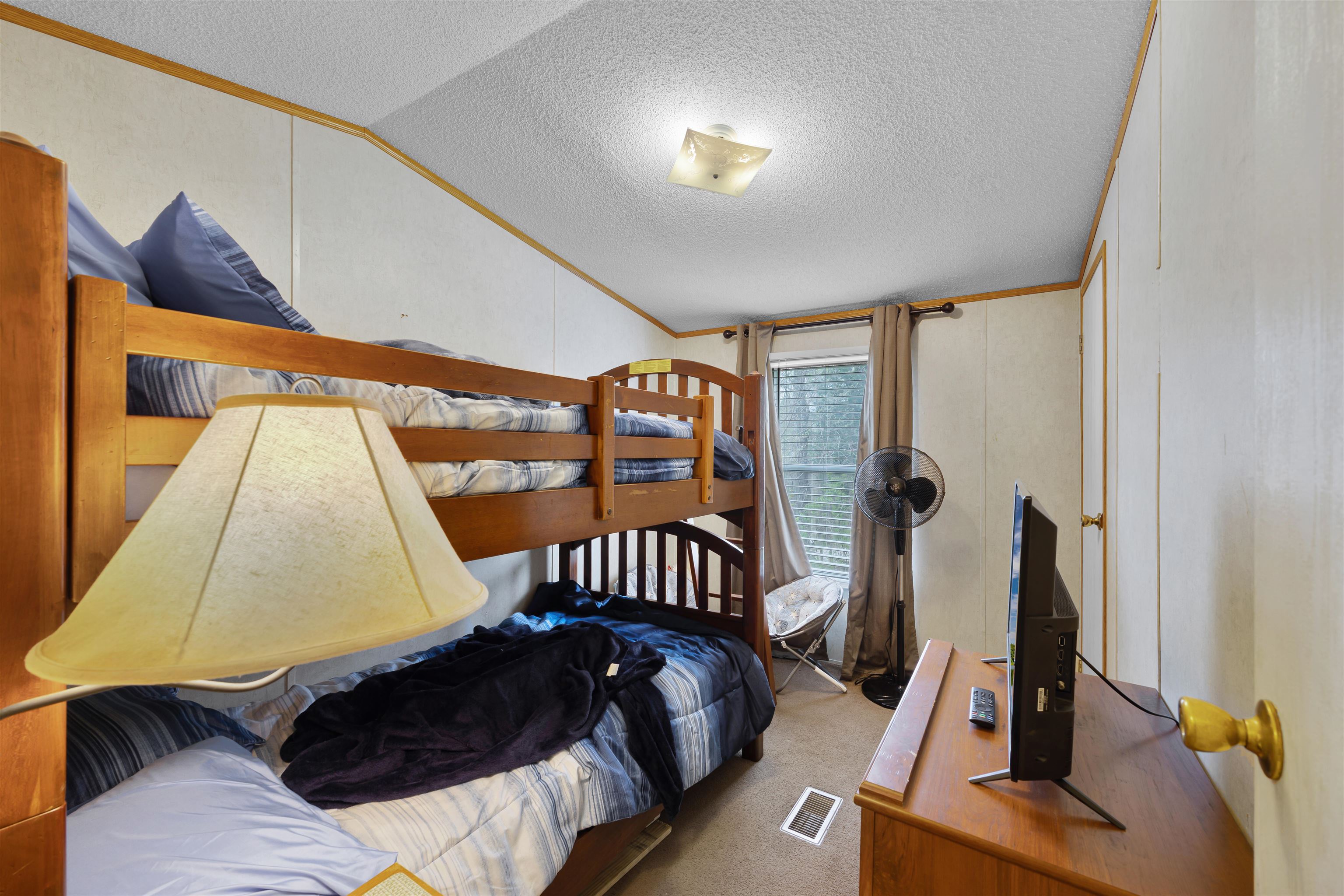 90 Rose Road Crump, TN 38327 - Photo 6 of 28 Bedroom with light carpet and ornamental molding