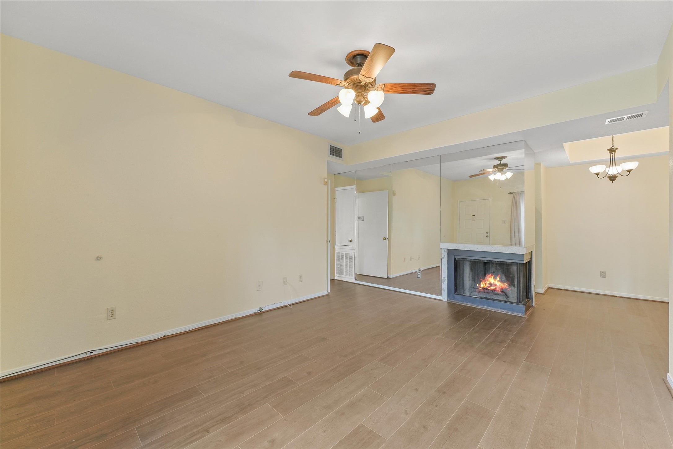 8055 Cambridge Street, Unit 21 Houston, TX 77054 - Photo 4 of 15 wooden floor in a hall with a window