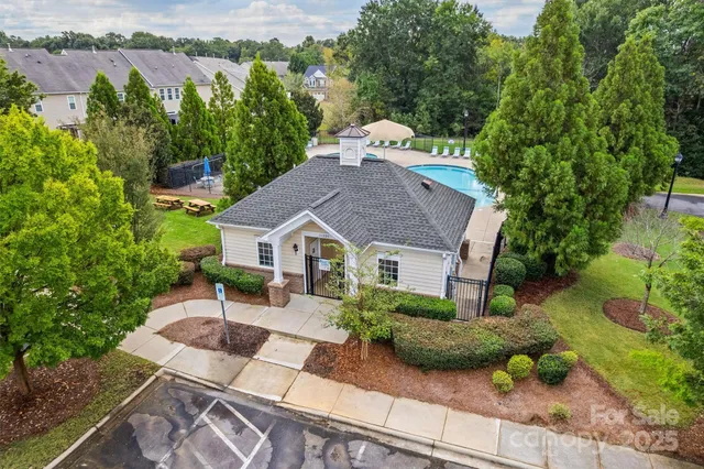 an aerial view of a house with yard patio and green space