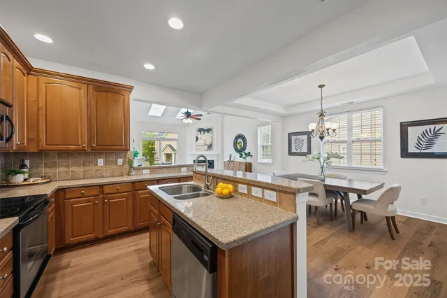 a kitchen with a stove sink and microwave