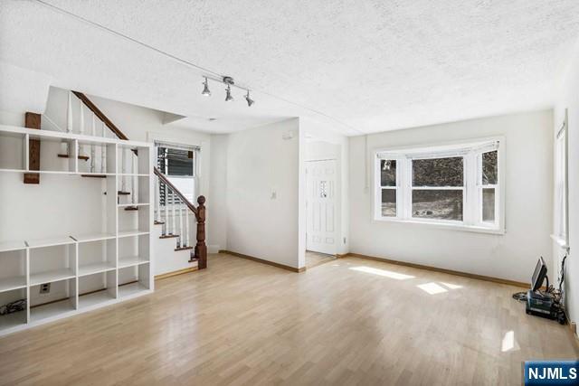 122 Spring Street Leonia, NJ 07605 - Photo 4 of 19 a view of an empty room with a window
