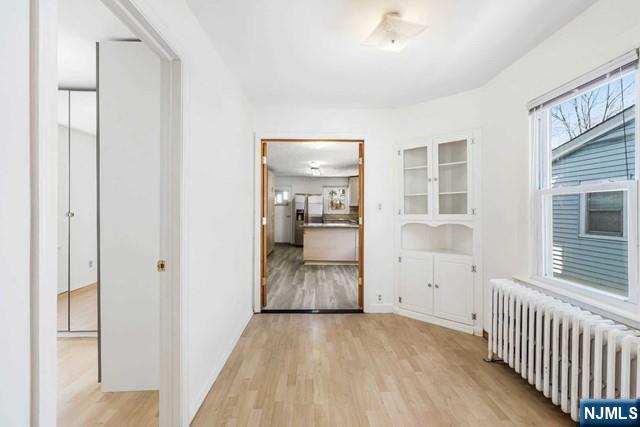 122 Spring Street Leonia, NJ 07605 - Photo 6 of 19 a view of a room with wooden floor and a bathroom