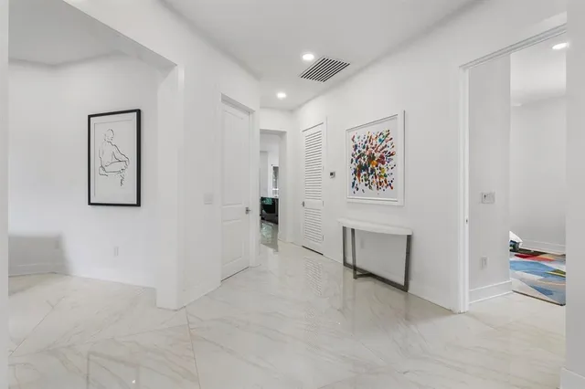 a view of workspace with furniture and wall paintings