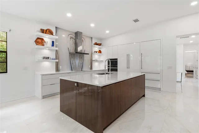 a kitchen with stainless steel appliances cabinets and refrigerator