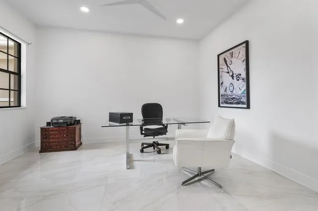 a view of a workspace with furniture