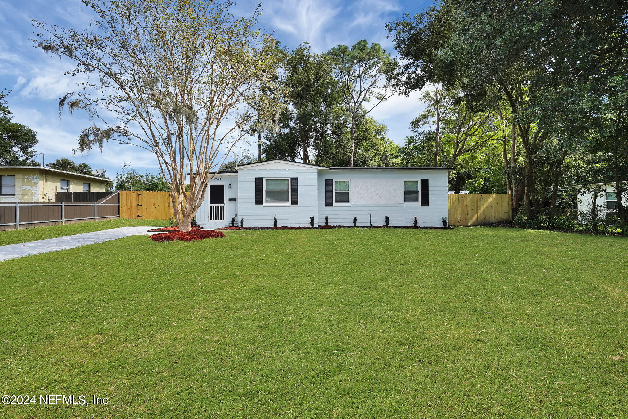 6763 Ector Road Jacksonville, FL 32211 - Photo 2 of 28 a front view of house with yard and green space