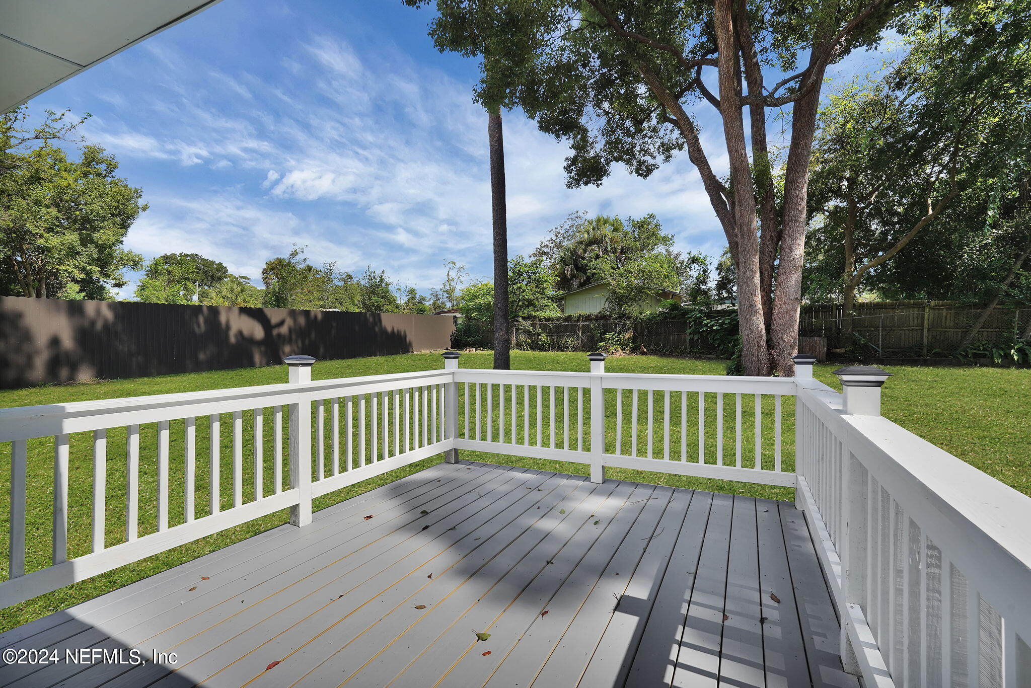 6763 Ector Road Jacksonville, FL 32211 - Photo 24 of 28 a view of balcony with wooden floor and fence