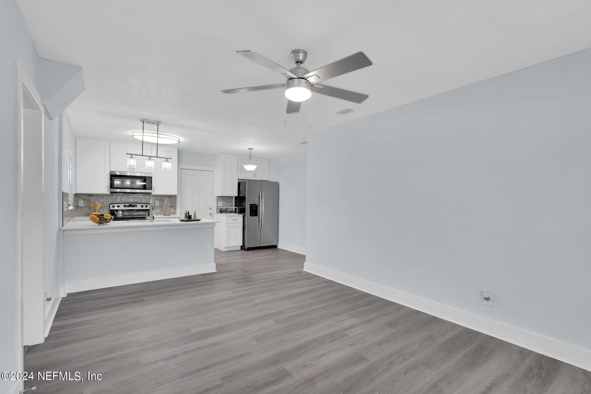 6763 Ector Road Jacksonville, FL 32211 - Photo 7 of 28 a view of kitchen with refrigerator microwave and stove