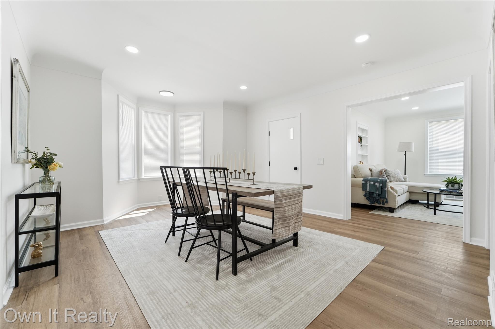 168 Kerby Road Grosse Pointe, MI 48236 - Photo 13 of 36 Open concept room featuring wood-finish flooring, recessed lighting, and a bay window