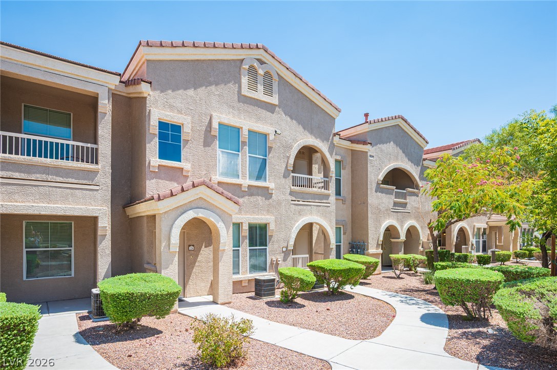 10550 West Alexander Road, Unit 2014 Las Vegas, NV 89129 - Photo 1 of 35 Architectural arches and Mediterranean roofing accents create inviting individual entries.