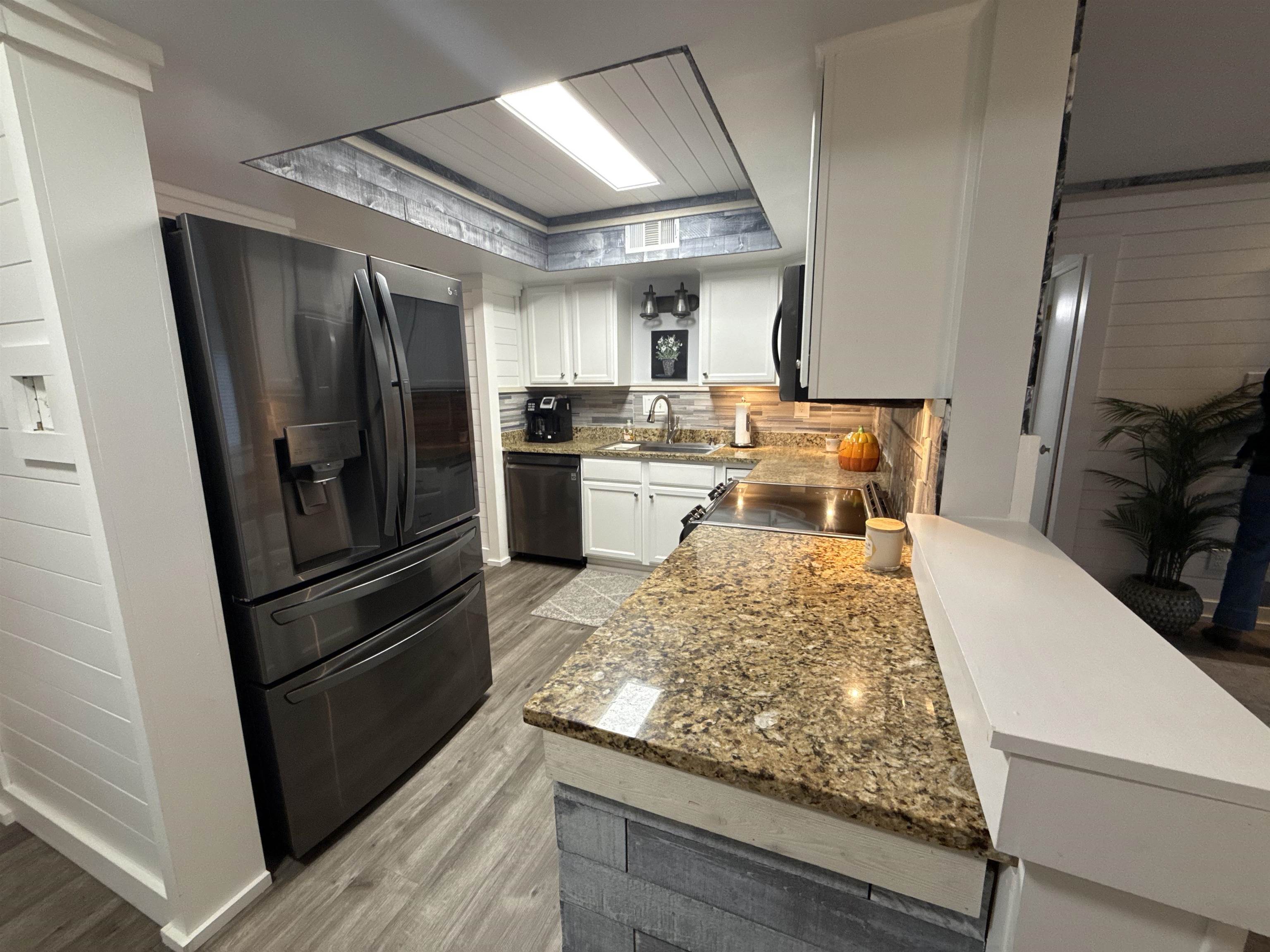 1814 Birch Post Cove, Unit 1 Germantown, TN 38138 - Photo 2 of 15 a kitchen with refrigerator and window