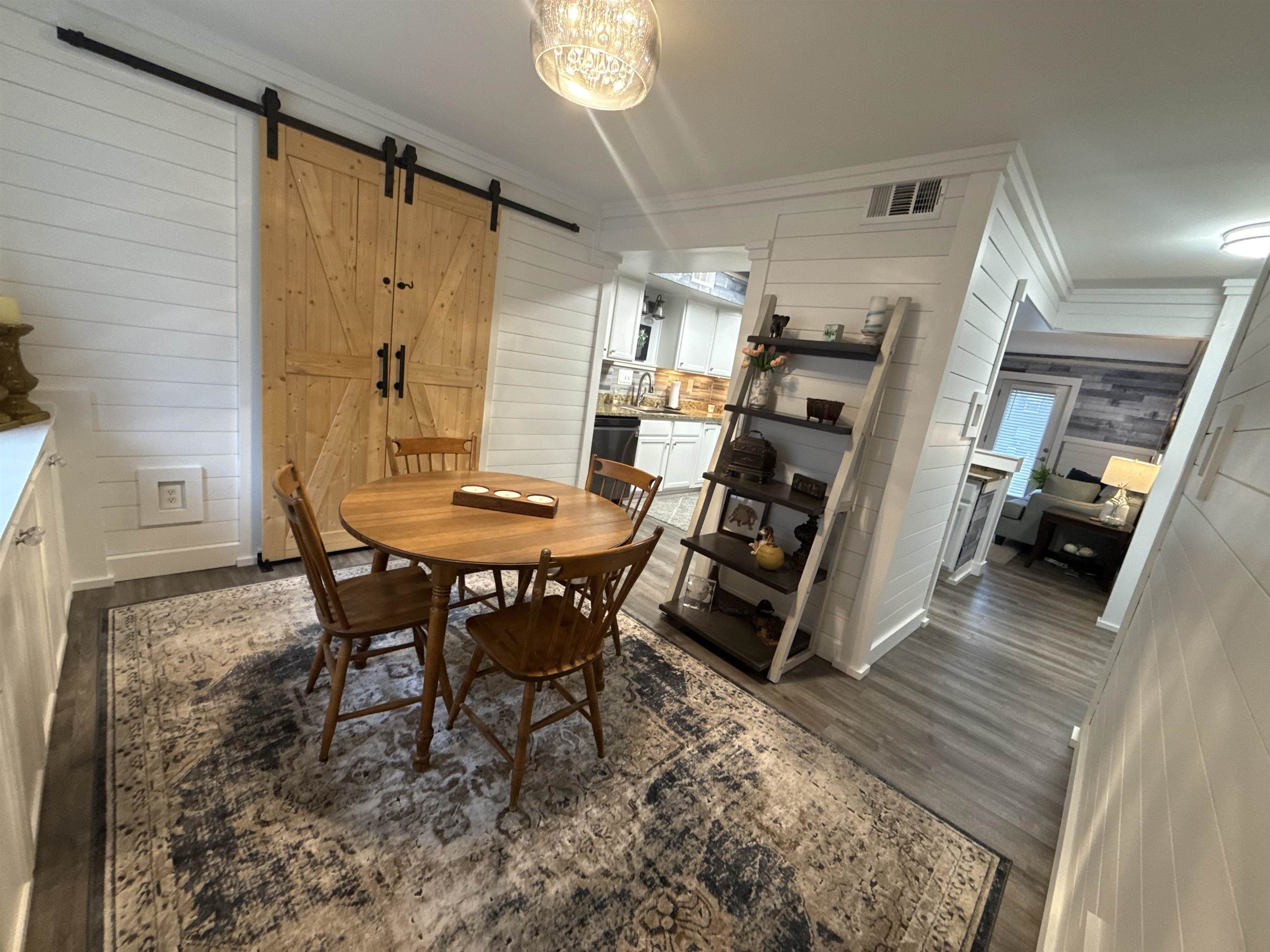 1814 Birch Post Cove, Unit 1 Germantown, TN 38138 - Photo 5 of 15 a view of a dining room with furniture and a chandelier