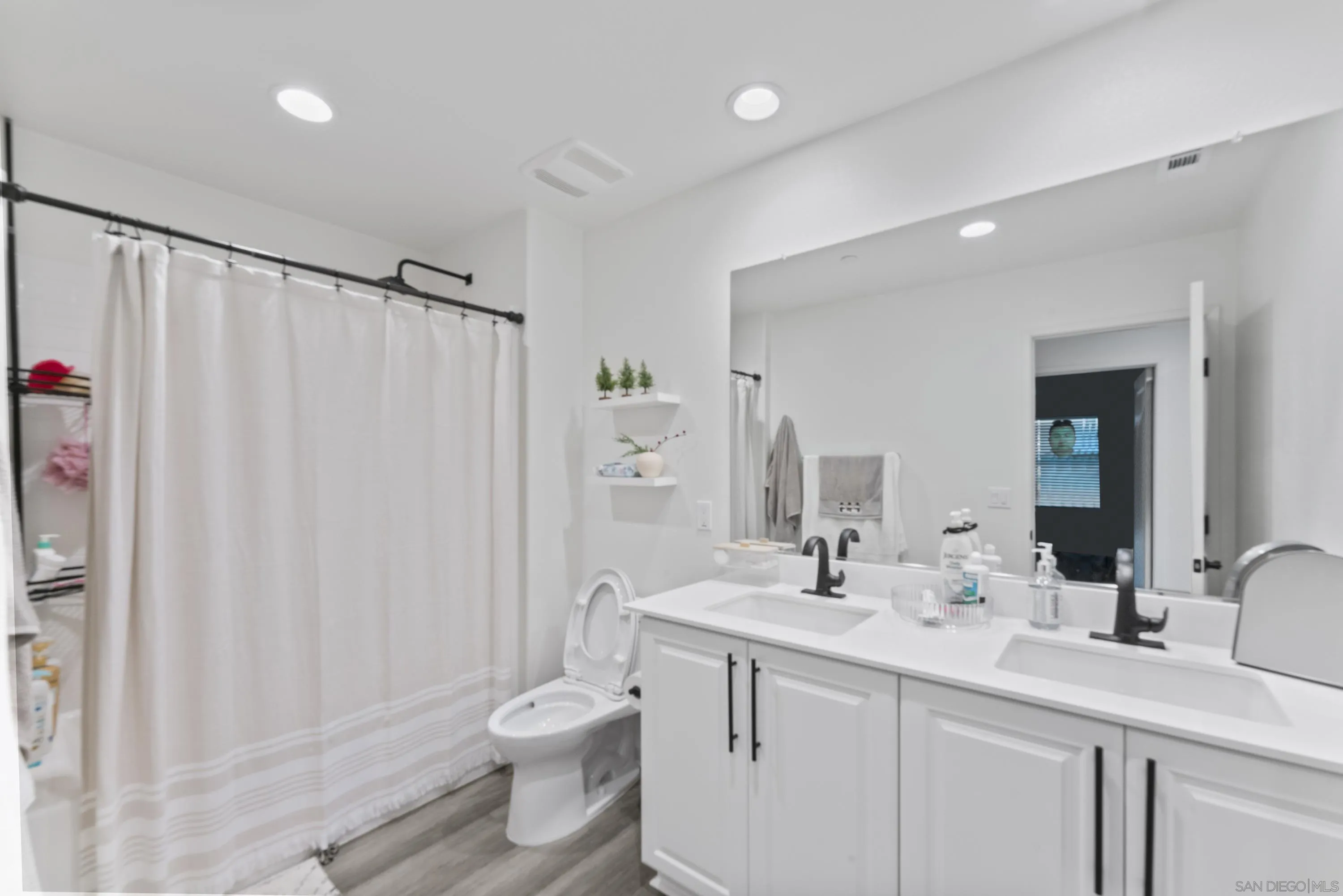 28032 Moosa Creek Way Valley Center Valley Center, CA 92082 - Photo 12 of 21 a bathroom with a double vanity sink toilet and shower
