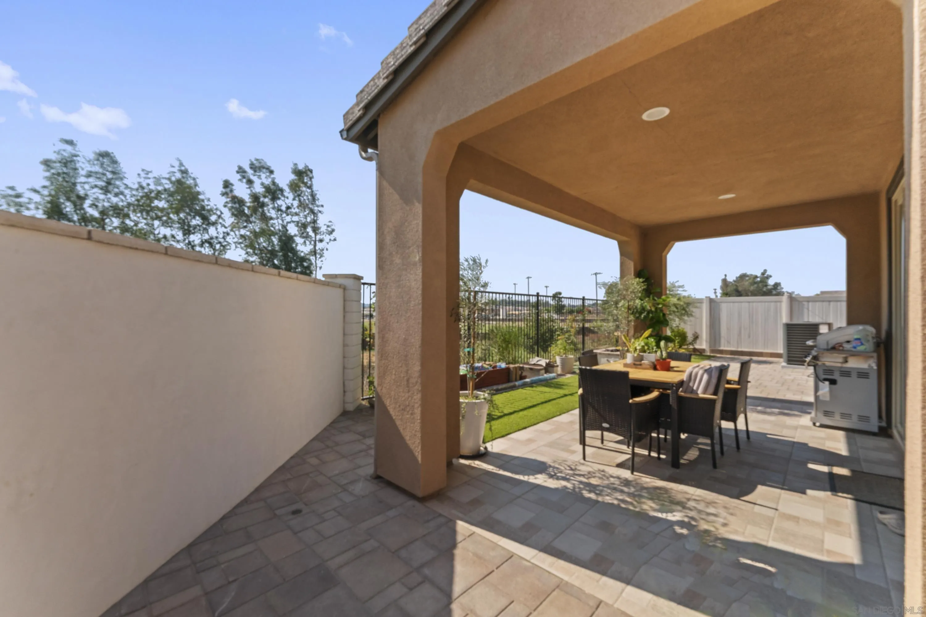 28032 Moosa Creek Way Valley Center Valley Center, CA 92082 - Photo 16 of 21 a view of a patio with a table and chairs