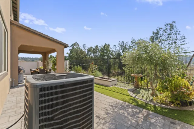 a view of a balcony with two chairs and a table