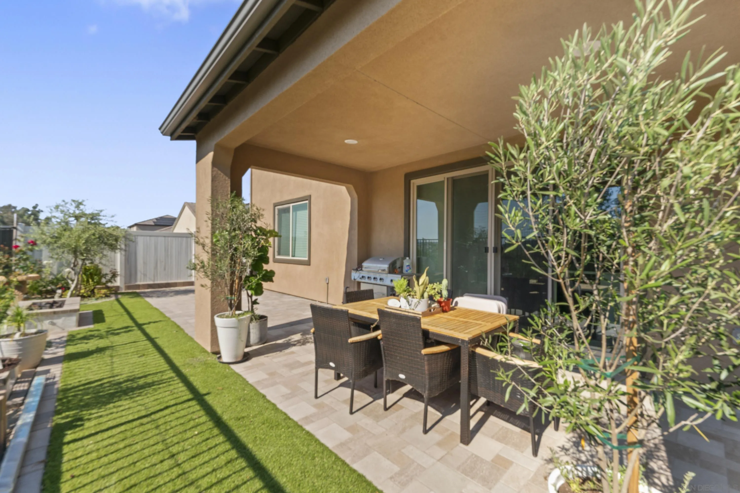 28032 Moosa Creek Way Valley Center Valley Center, CA 92082 - Photo 18 of 21 a view of a patio with table and chairs and potted plants