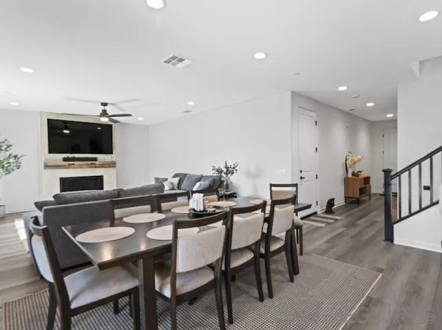 28032 Moosa Creek Way Valley Center Valley Center, CA 92082 - Photo 2 of 21 a view of a dining room with furniture and wooden floor