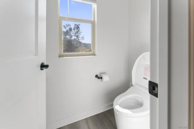 a bathroom with a toilet and a sink