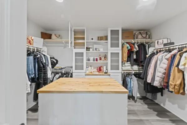 a view of a kitchen with fridge and closet
